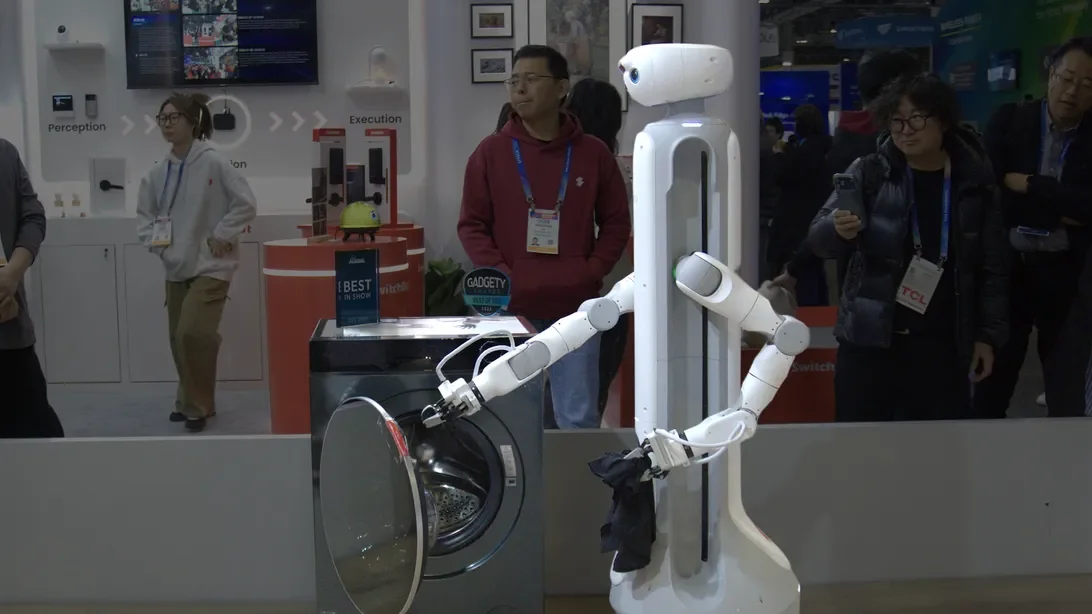 Robot Laundry Loader at CES Sparks Debate on Automation Efficiency and Future Use
